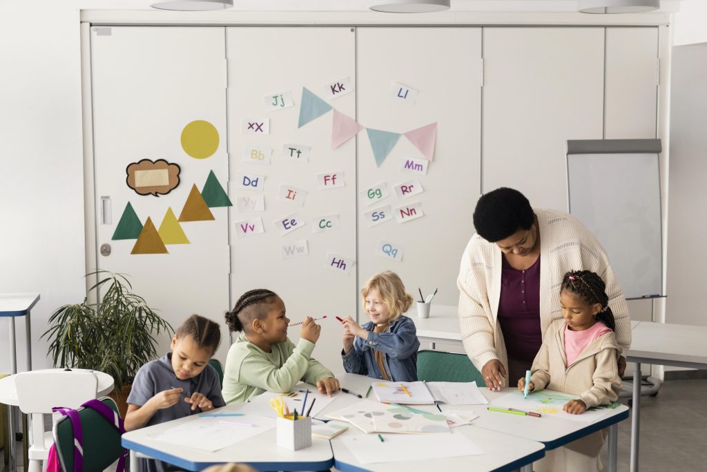 children drawing together classroom